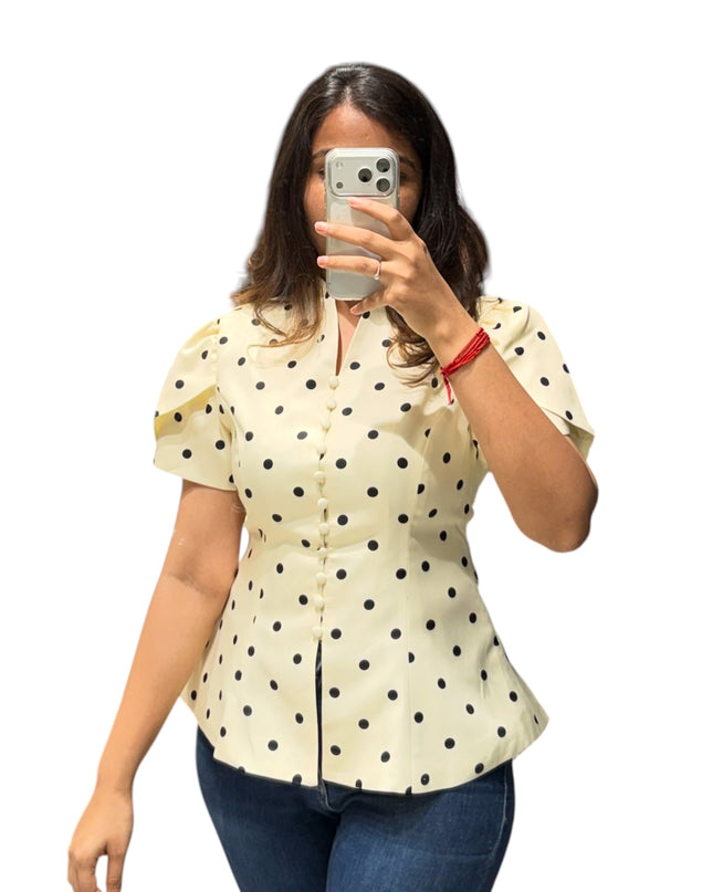 Sagar hill road butter yellow polka dot peplum top with button-front, short sleeves, and a flattering fit and flare silhouette.