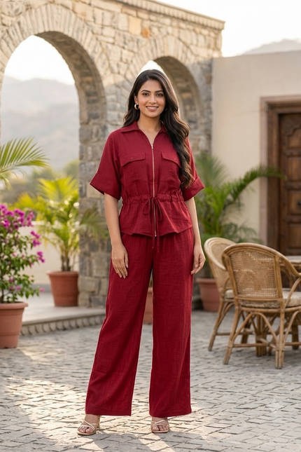 Sagar hill road deep red utility co-ord set with a zip-front shirt and wide-leg trousers worn by a smiling woman
